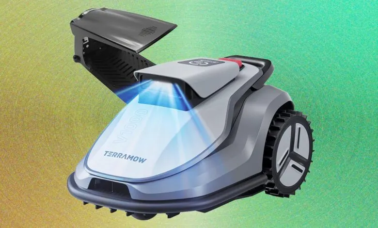 TerraMow V1000 robotic lawn mower with open compartment against abstract background