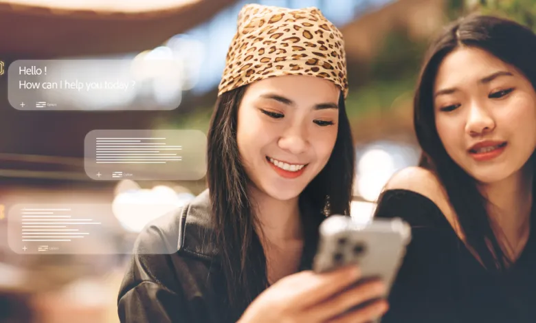 Two young women smiling while interacting with a smartphone and floating AI chat interfaces.