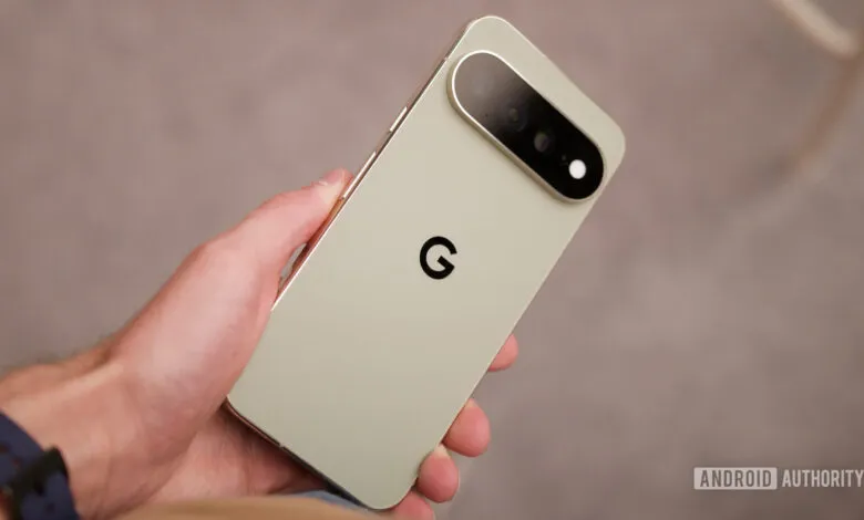A person holding a light green Google Pixel smartphone, showcasing its back panel and camera bar.
