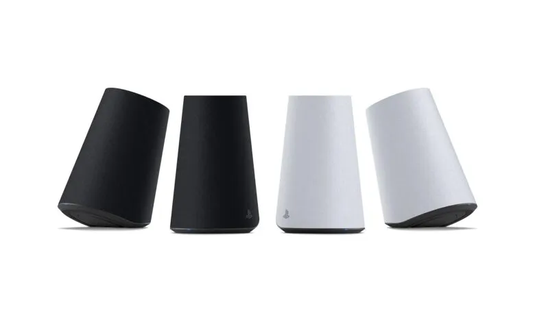 Four PlayStation wireless speakers in black and white arranged against a white background.