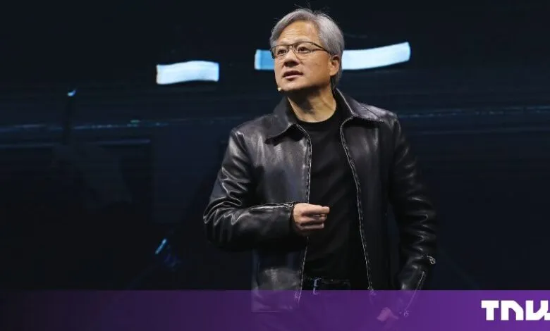 NVIDIA CEO Jensen Huang wearing his signature black leather jacket on stage