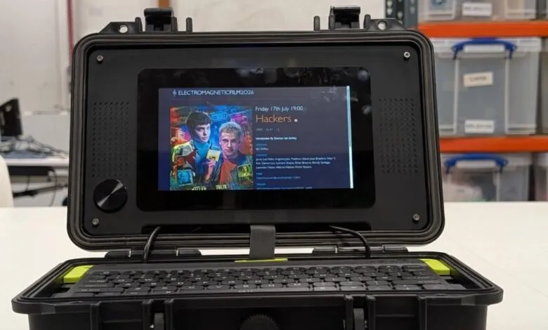 A custom Raspberry Pi cyberdeck housed in a rugged black case displaying the movie Hackers.