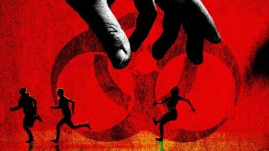 A giant hand looms over tiny fleeing figures against a red background with a biohazard symbol.