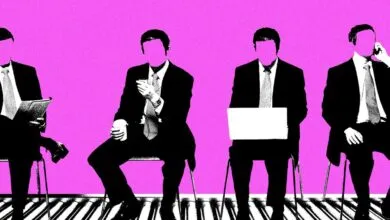 Four faceless businessmen in suits sitting on chairs against a bright pink background.