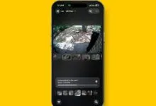 Smartphone displaying the Home app interface with a live security camera feed of a yard.