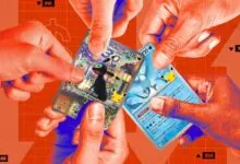 Multiple hands holding valuable Pokemon trading cards against an orange background