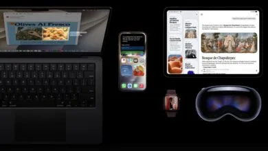 An assortment of Apple devices including a MacBook, iPhone, iPad, Apple Watch, and Vision Pro.