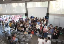Large group of diverse attendees posing for a photo inside the Beirut Digital District at the Lebanon AI Festival 2026.
