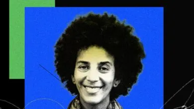 Portrait of AI researcher Timnit Gebru against a vibrant blue and black background.