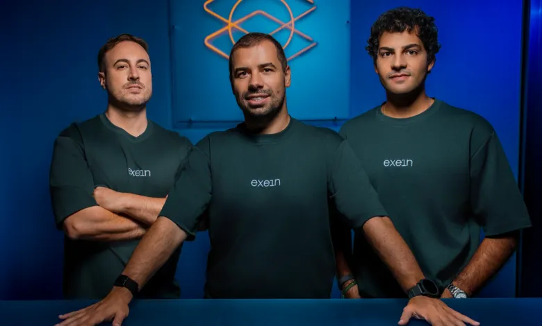 Three Exein founders Gerardo Gagliardo, Gianni Cuozzo, and Giovanni Falcione in dark blue shirts.