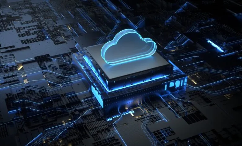 Glowing blue cloud icon hovering above a microchip on a complex dark circuit board background.