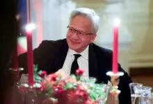NVIDIA CEO Jensen Huang smiling at a formal white house state dinner
