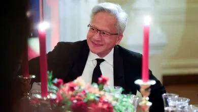 NVIDIA CEO Jensen Huang smiling at a formal white house state dinner