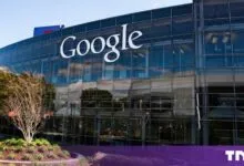 Exterior view of a modern Google office building with large glass windows and the company logo.