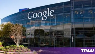 Exterior view of a modern Google office building with large glass windows and the company logo.