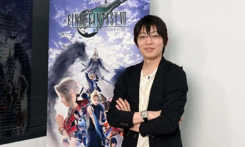 Game developer Naoki Hamaguchi standing with arms crossed in front of a Final Fantasy VII banner