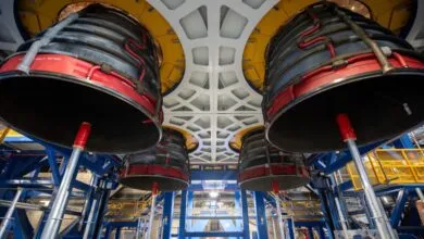 Four massive RS-25 rocket engines installed on the Artemis III core stage in the Vehicle Assembly Building.