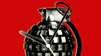 A grenade shaped like a computer keyboard against a bright red background.