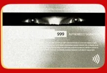 Close-up of a credit card back featuring glowing eyes hidden in the signature strip.