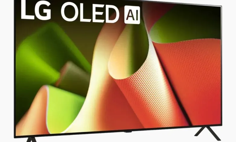LG OLED AI television displaying a vibrant abstract image with green, orange, and white textures.