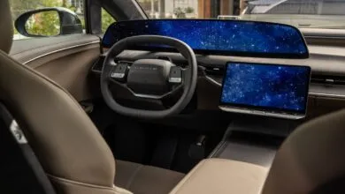 Luxurious interior of the Lucid Gravity SUV featuring a wide digital display and steering wheel.
