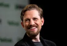 Portrait of WordPress co-founder Matt Mullenweg smiling warmly at an event.