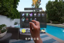 A hand interacts with a virtual reality home menu floating by a swimming pool.