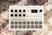 White Engram thoughtful things music production device resting on a patterned oriental rug
