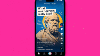 A smartphone displaying a TikTok video about the ancient Greek philosopher Socrates against a pink background.