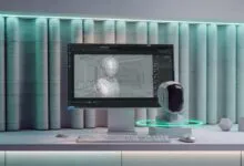 Modern workspace displaying a 3D robot model on screen with a physical robot head bust.