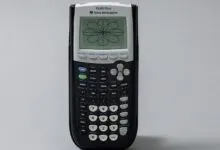 Texas Instruments TI-84 Plus graphing calculator displaying a floral mathematical pattern.