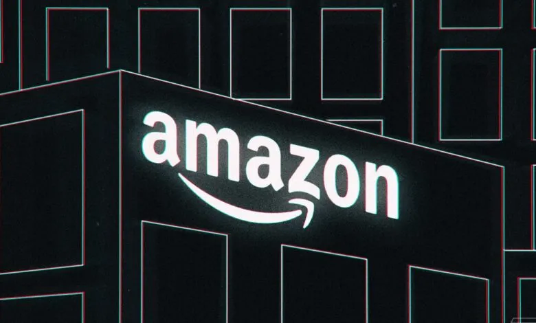 Illuminated Amazon logo on a building with a cyan and red chromatic aberration effect.