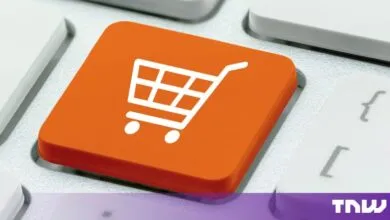 Close-up of an orange keyboard key with a white shopping cart icon for e-commerce.