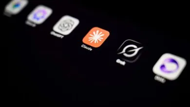 Close-up of a smartphone screen displaying various AI application logos, including Claude and ChatGPT.