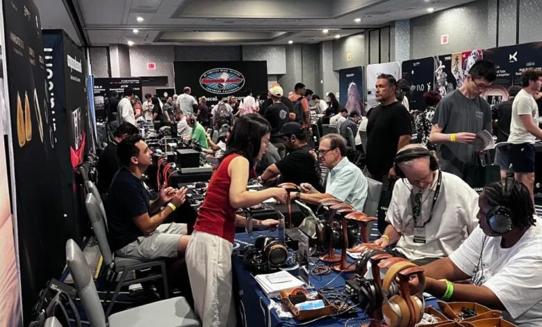 Exhibition hall filled with attendees testing high-end headphones at crowded CanJam SoCal show floor