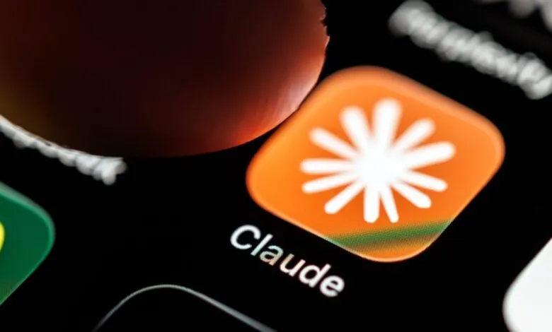 A finger about to tap the orange Claude AI app icon on a smartphone screen.