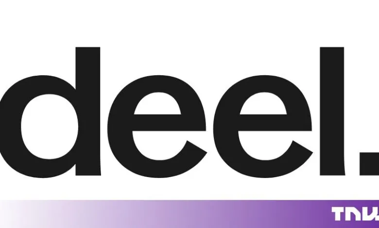 The Deel company logo in bold black lowercase letters on a clean white background with a TNW watermark.