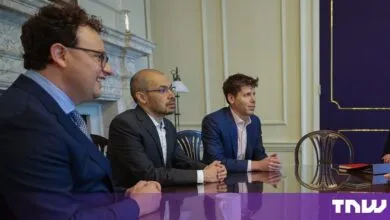 Tech leaders Dario Amodei, Demis Hassabis, and Sam Altman seated together at a conference table