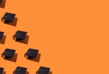 Pattern of black graduation caps with gold tassels arranged on a vibrant orange background.