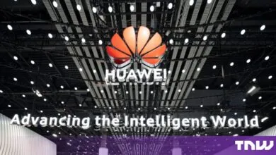 Illuminated Huawei logo displayed below a modern ceiling structure at MWC 24
