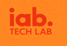 The IAB Tech Lab logo displayed on an orange background with faint circuit board patterns.