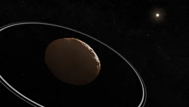 Dwarf planet Haumea with its distinctive rings floating in deep space against a starry backdrop