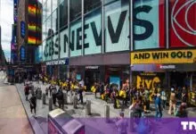A long queue of people lines up outside the newly opened Insta360 store in New York City's Times Square.