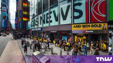 A long queue of people lines up outside the newly opened Insta360 store in New York City's Times Square.
