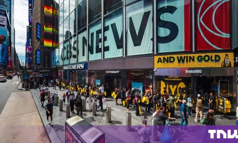 A long queue of people lines up outside the newly opened Insta360 store in New York City's Times Square.
