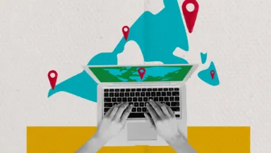 Top-down view of a person typing on a laptop with a world map background and location pins.
