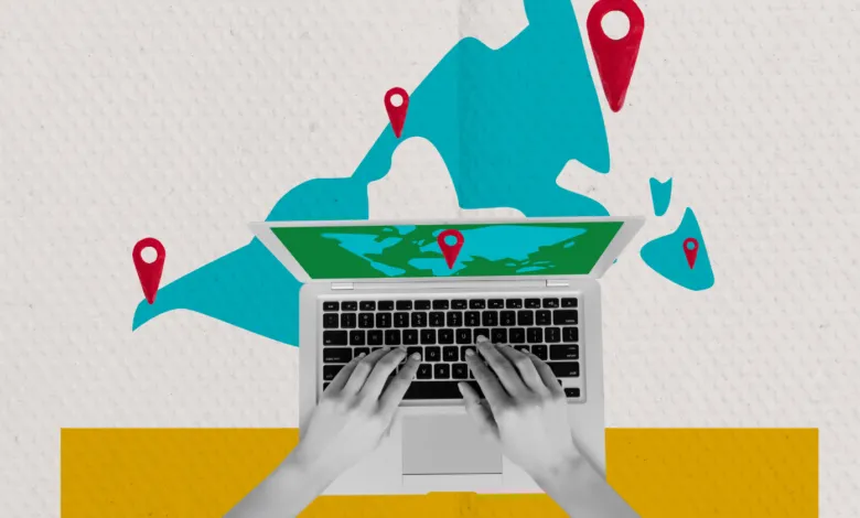 Top-down view of a person typing on a laptop with a world map background and location pins.