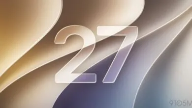 The number 27 in frosted glass over an abstract beige and purple background.