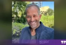 Portrait of Krishna Rangasayee, Founder and CEO of SiMa.ai, smiling outdoors.