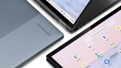 Close-up of a blue Chromebook Plus laptop closed and another open displaying the ChromeOS interface.